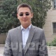 Блогер Элмир Сыдымановдун соттук отуруму саналуу мүнөттөрдөн кийин башталат