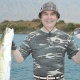 Түркмөнстандын президенти эс алууда жүрүп кармаган балыктарын балдар үйүнө берди