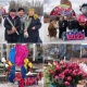 Бишкекте гүл көтөргөн апалар, эжелер, кыздардын майрамдык маанайы сүрөттөрдө